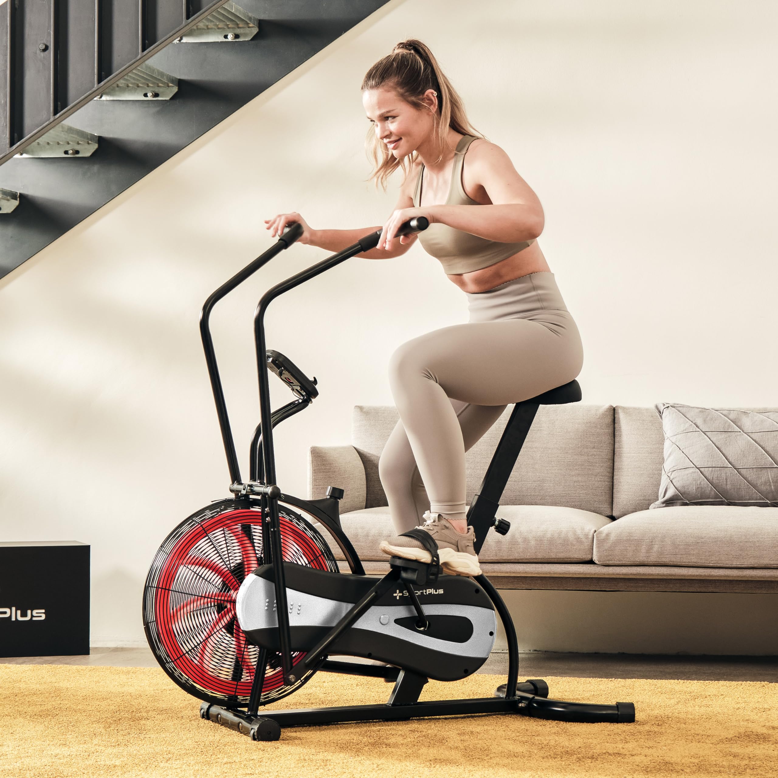 SportPlus Air Bike mit Luftwiderstand und Riemenbremssystem - effizienter HIIT Heimtrainer für Arme und Beine, mit Trainingscomputer, sicher & stabil bis 100kg, kompakte Maße, SP-FB-1000